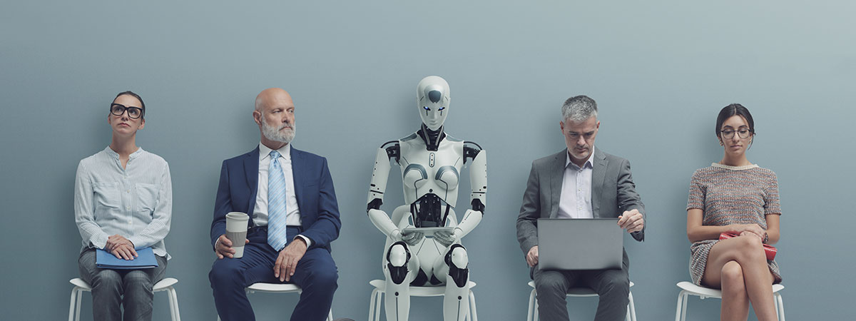 Image shows a lineup of four individuals with one humanoid robot in the center seated side by side against a plain, light grey background. From left to right, there is a young woman wearing glasses and a striped shirt, holding a notebook; a bald man in a suit and tie holding a coffee cup; the robot, which is white with black accents and has a humanoid shape but with a distinctly mechanical design; a middle-aged man checking a wristwatch, also in a suit; and a young woman with glasses, wearing a patterned dress and holding a red folder on her lap. They all sit on white stools, spaced evenly apart, and appear to be waiting for something, evoking a sense of a waiting room or interview scenario. The scene is a conceptual representation of the integration of technology and artificial intelligence with human activity in a professional or corporate environment.